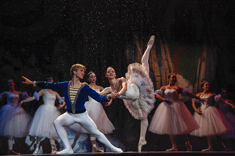 Wendy Langton and Ian Zeisel as the Snow Fairy and her Cavalier pose and snow drifts down around the dancers.