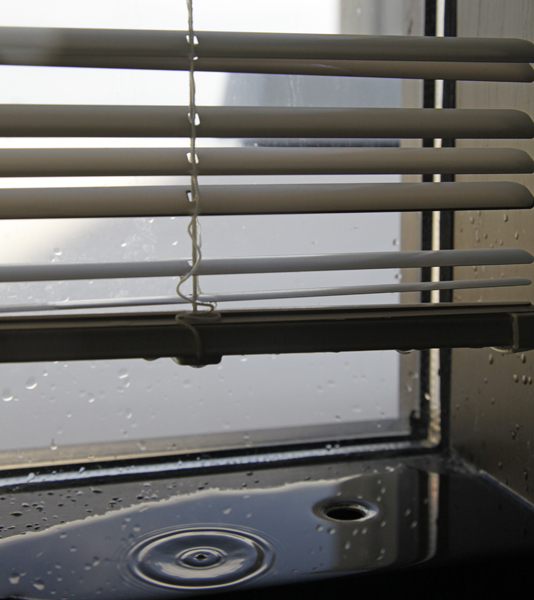 Ripples radiate on a window sill in UAF's Fine Art Complex during a warm March afternoon. 