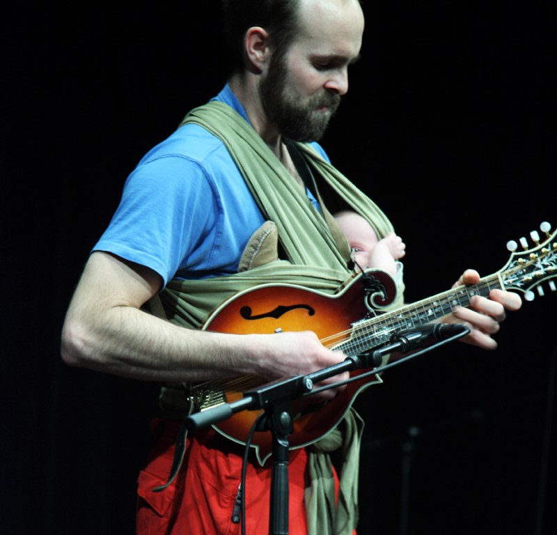 Bruno Grunau, of the band Ice Jam, plays mandolin with his 6-week-old daughter Annabelle. 