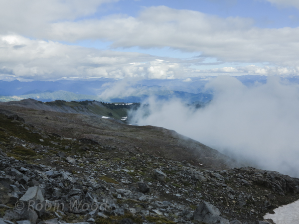 Clouds lift, if only for a moment, to reveal a expansive view. 