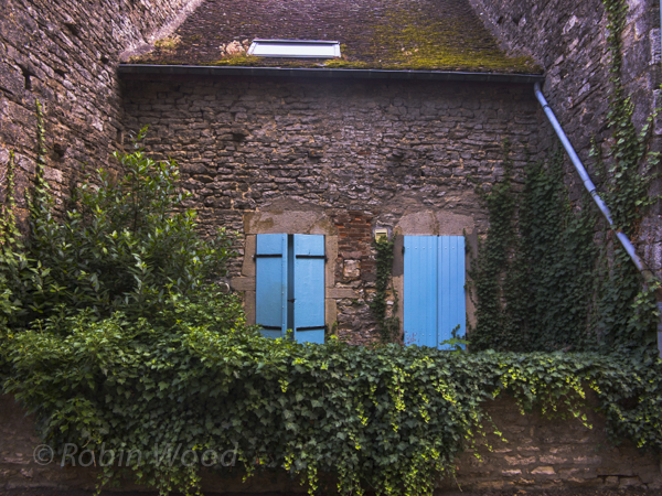 Cool blues and greens on the brick house contrasted the hot mid-July temperatures. 