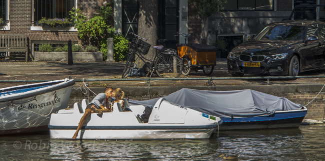 Stealing a kiss on a canal in Amsterdam.